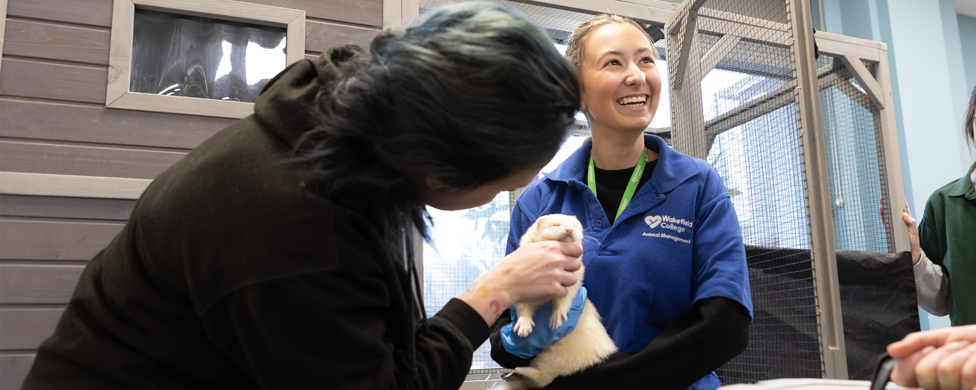 Student holding a ferret