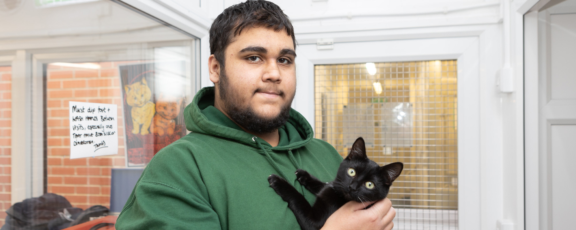 Student holding a cat