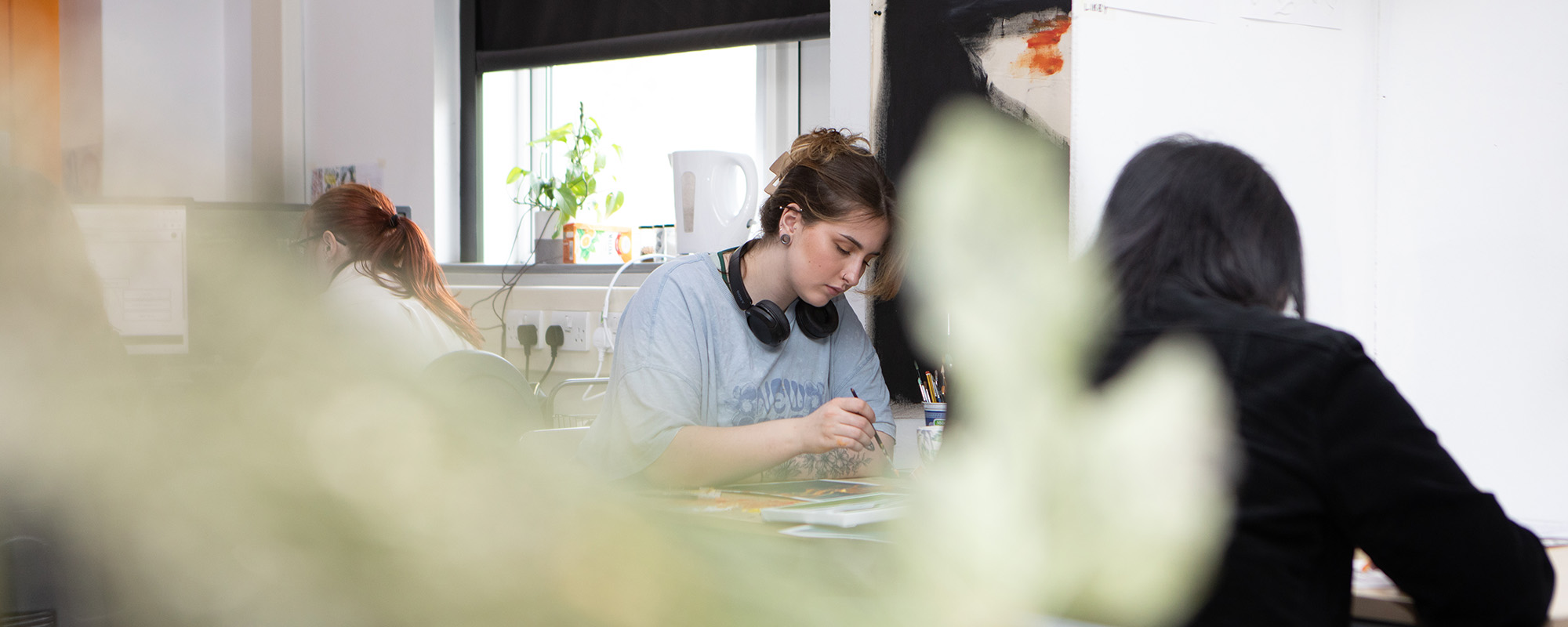 Art student working at desk 