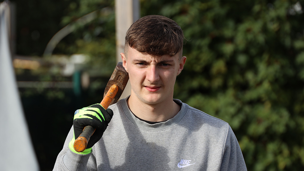 Student holding hammer