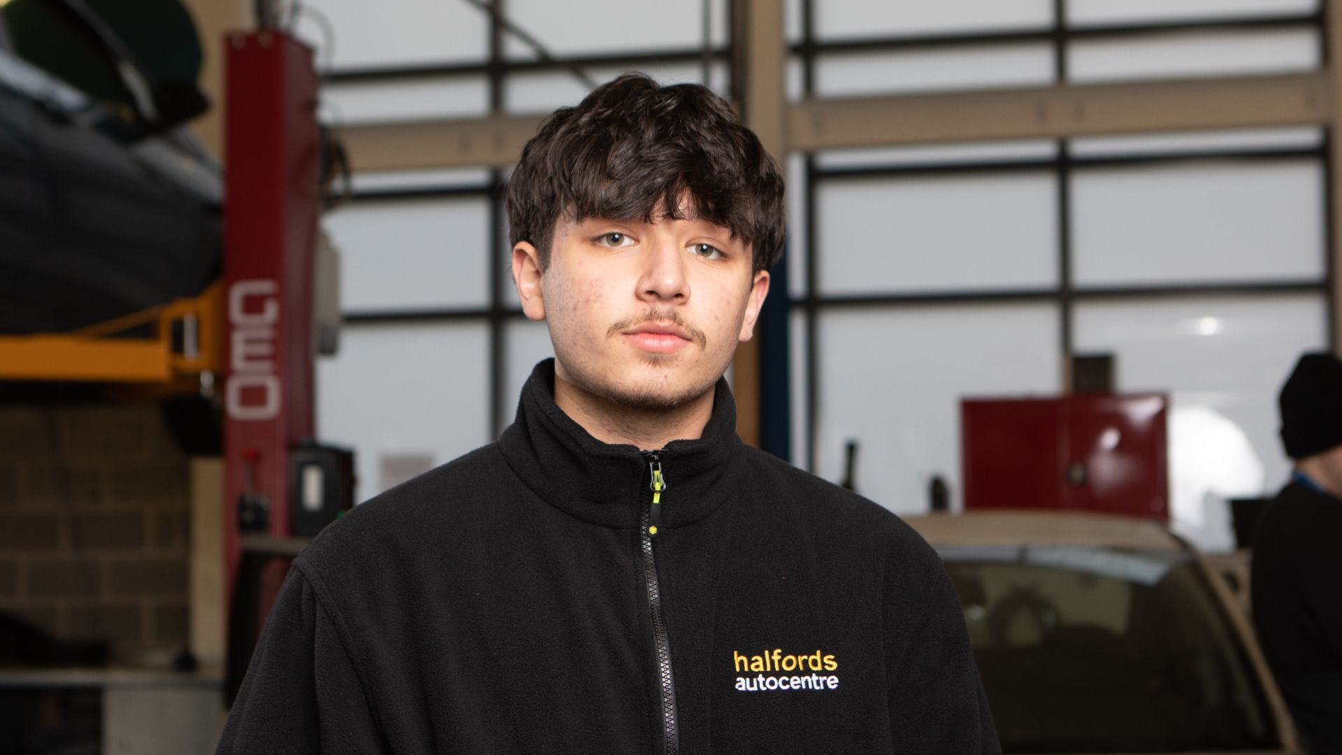 Haroon in the College's automotive department 