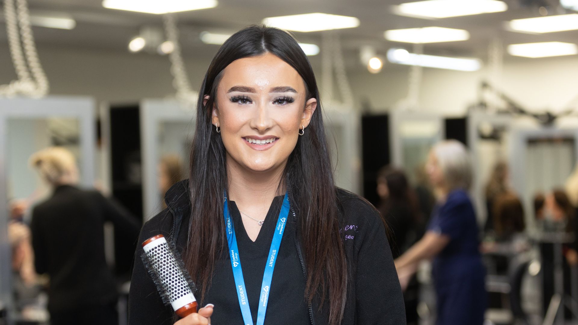 Danielle holding a hair brush 