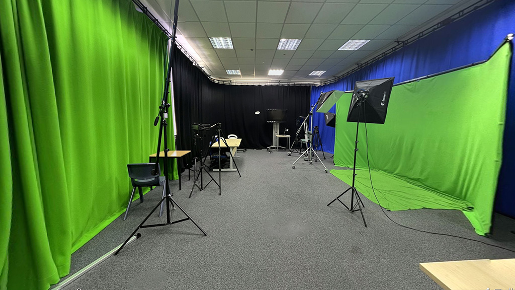 Photo of the film studio with green screens set up