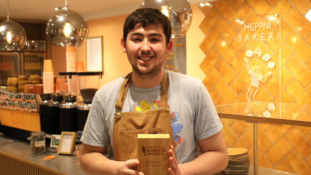 Image of Mark Curran holding his award