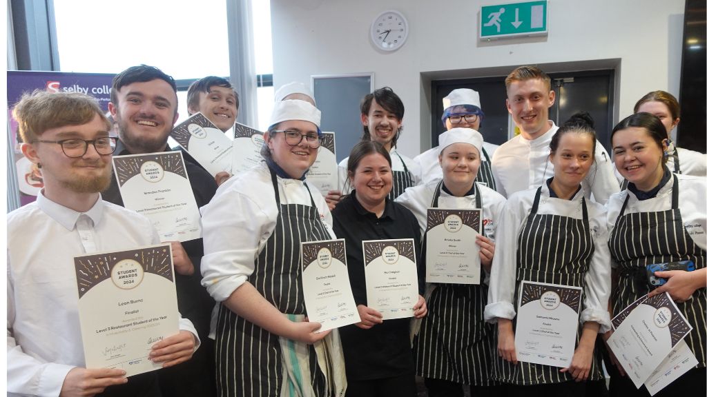 Students with certificates at the Hospitality & Catering Awards 2024 