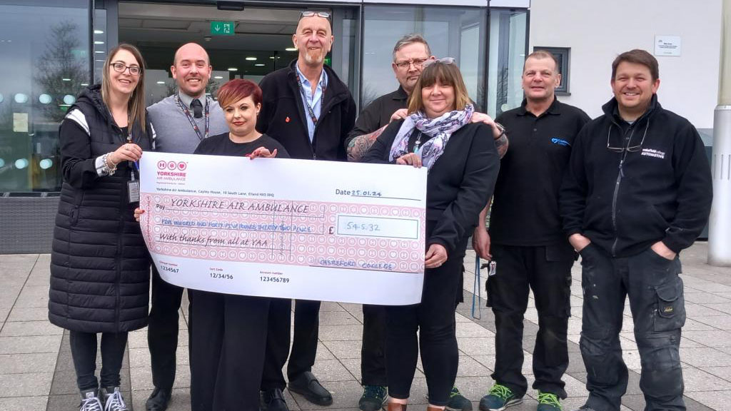 Castleford College staff with their cheque for Yorkshire Air Ambulance