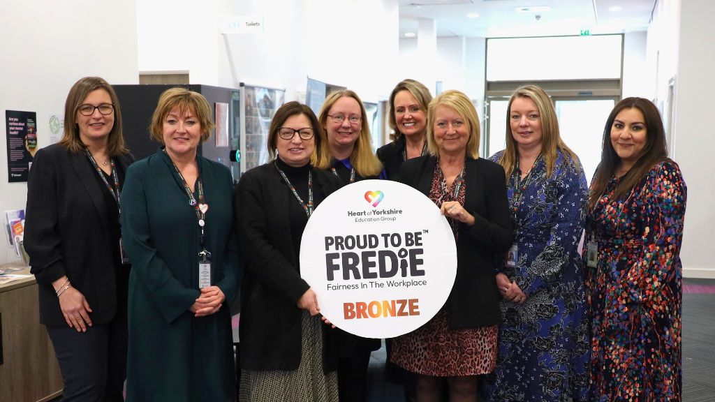 Colleagues from the Heart of Yorkshire Education Group with the Proud to Be FREDIE sign