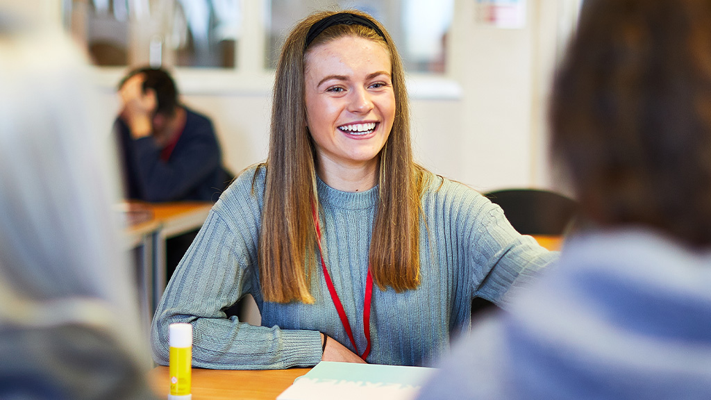 Female student smiling in classroom