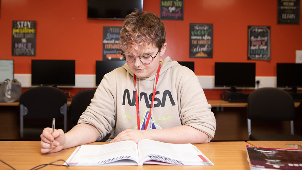 A student reading a classroom