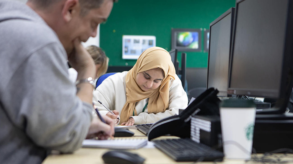 Business student in an IT room