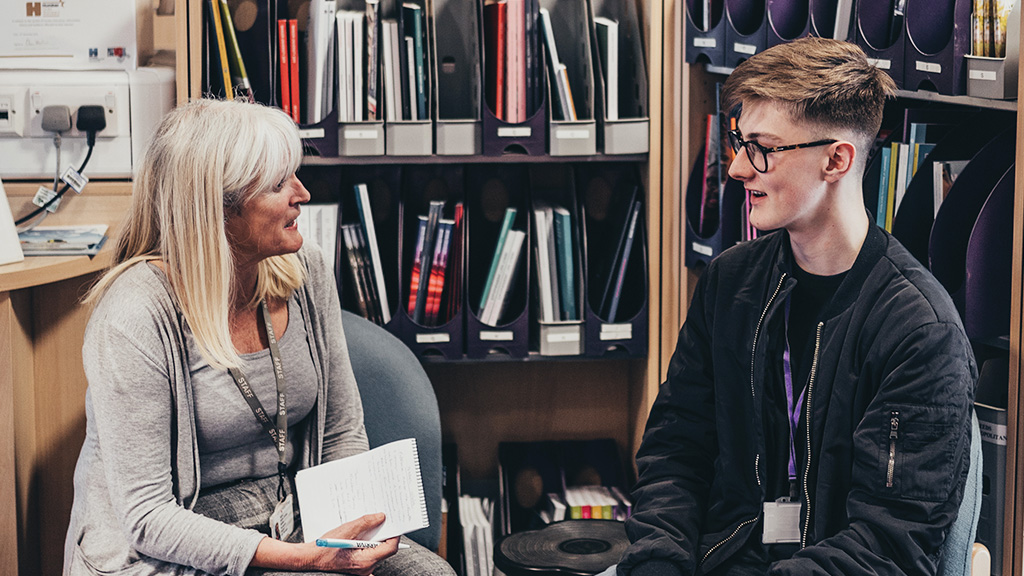 Careers advisor talking to a student