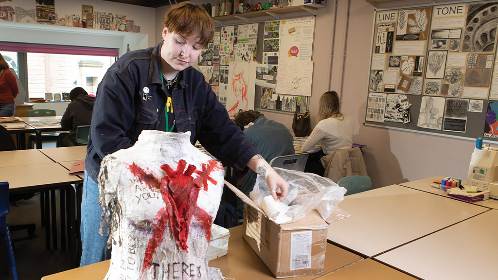 Student working on a sculpture