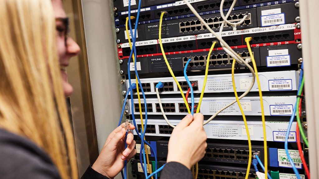 Female student working on IT equipment