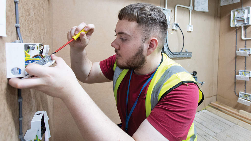 Student working on electrical sockets