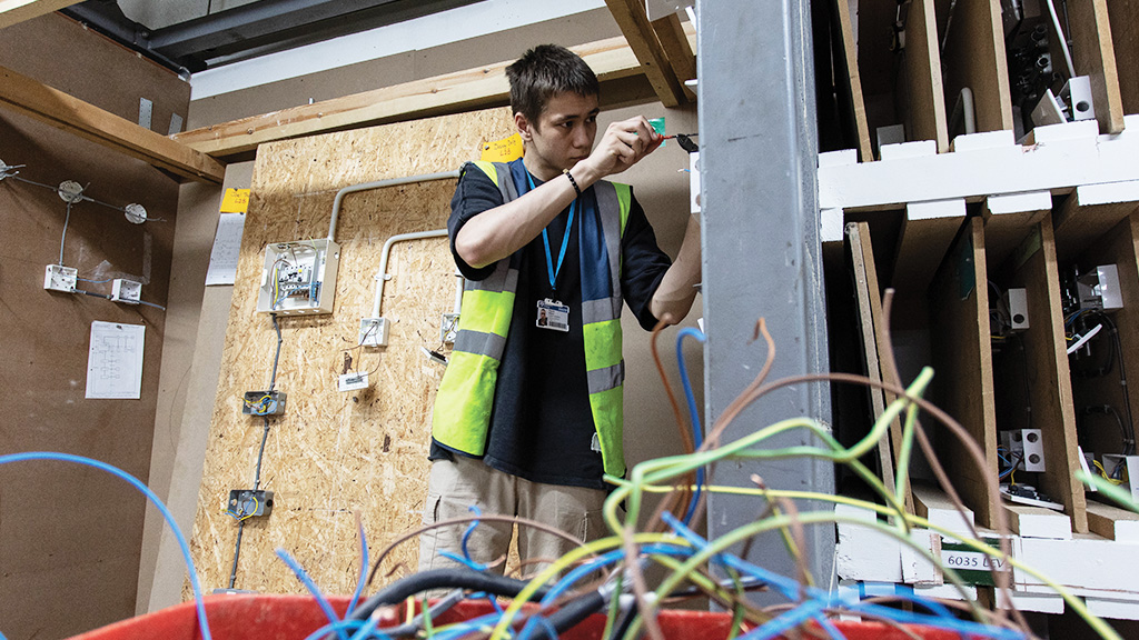 Student working on electrical sockets