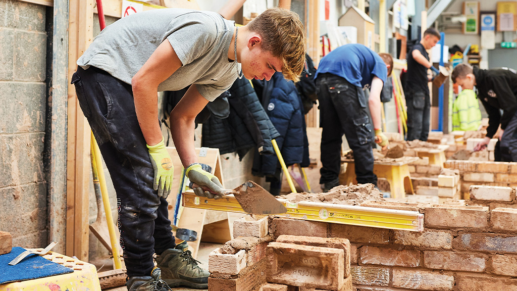 Construction students in the brick laying workshop