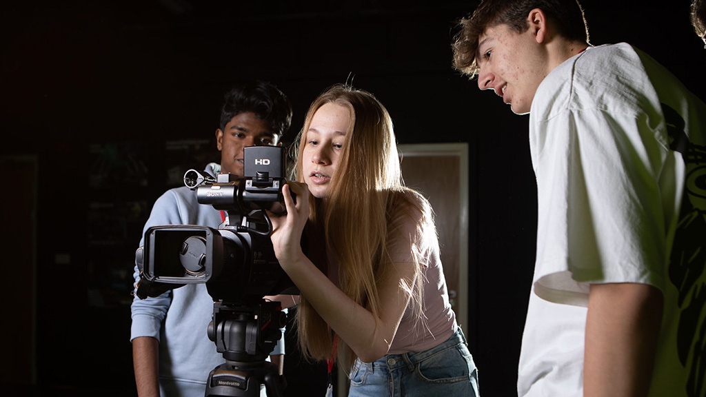 Student with camera equipment