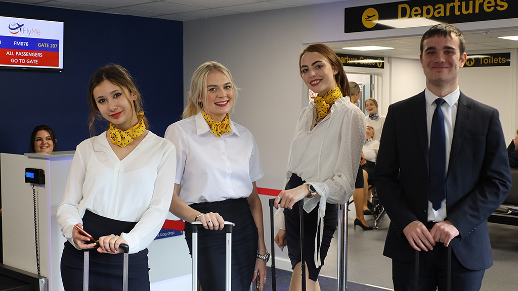 Travel & Tourism students posing with their uniforms